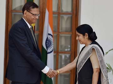 Sri Lankan Foreign Minister G L Peiris with his Indian counterpart Sushma Swaraj in New Delhi on Friday. PTI